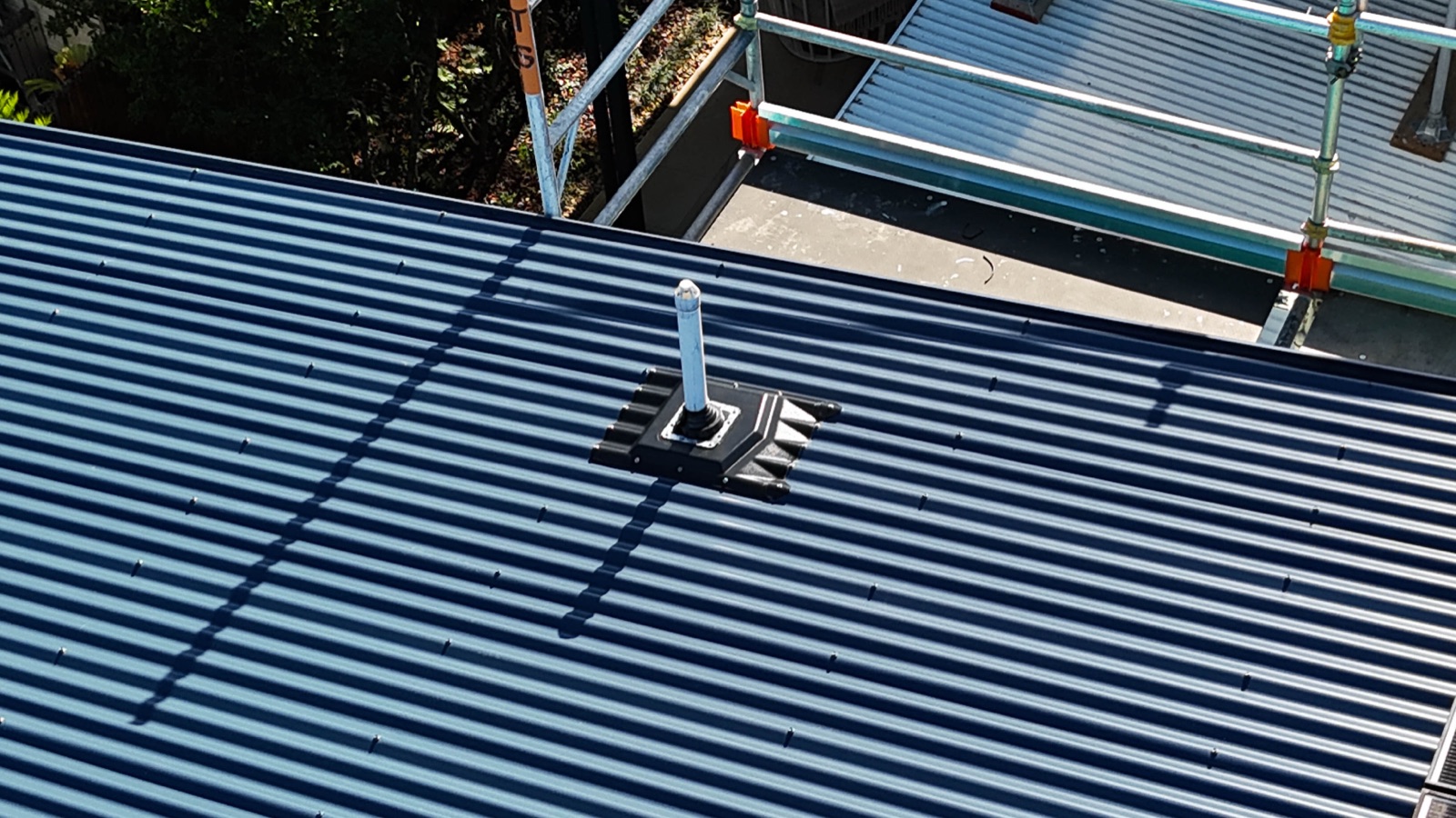 Aerial view of a Bribie Island roof with Penenator flashings installed across the penetrations