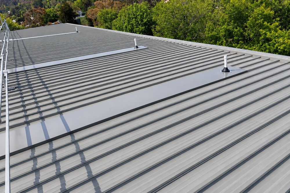 The old method — long metal drypan trays running down a metal roof